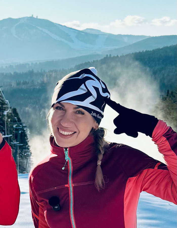 Dark Bkena cap on a cross-country runner in the mountains